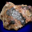 Uraninite in Albite